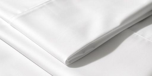 Close up of high thread count white cotton sheets